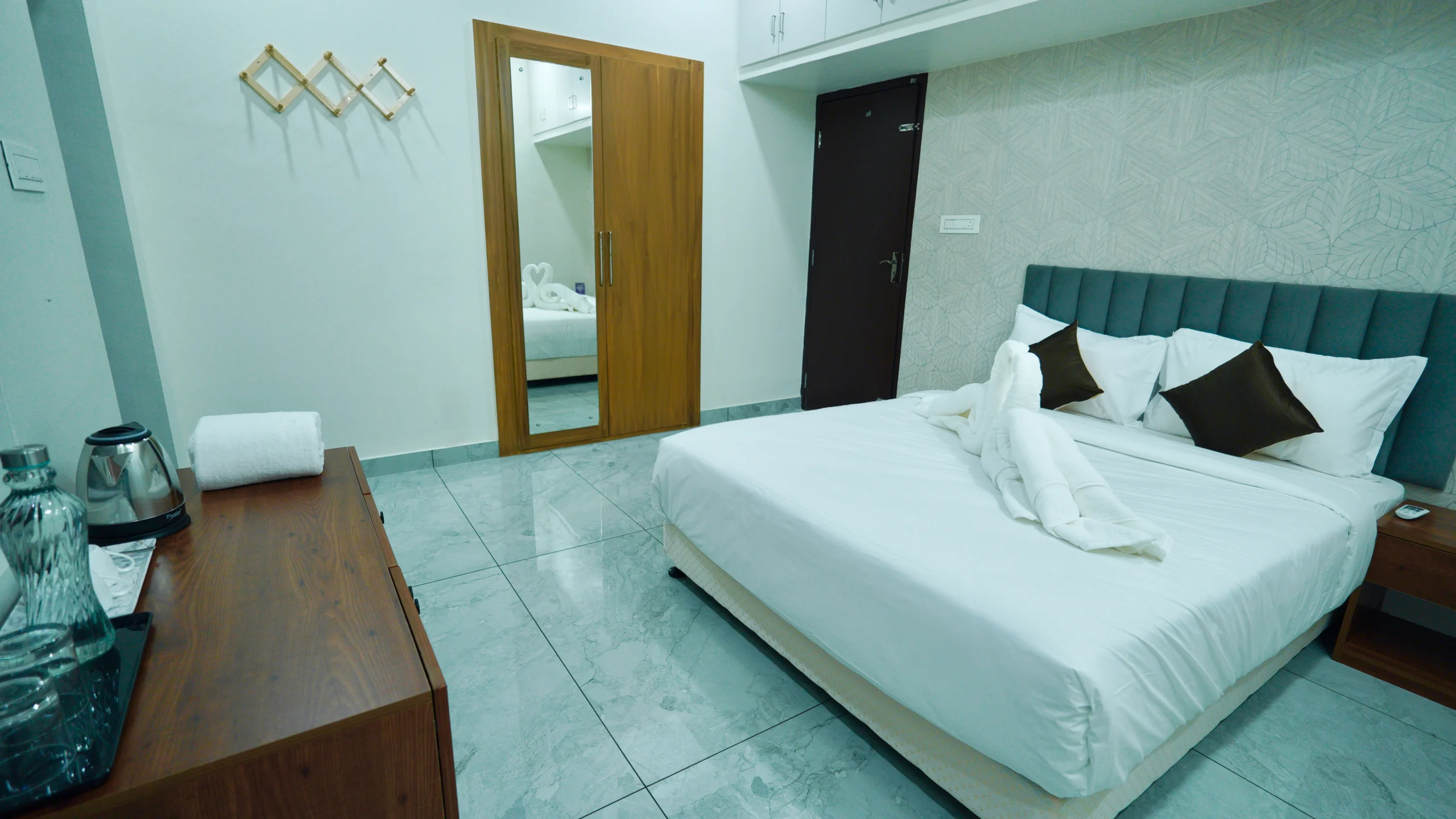 Spacious AC bedroom in private pool villa with modern interiors and comfortable bed