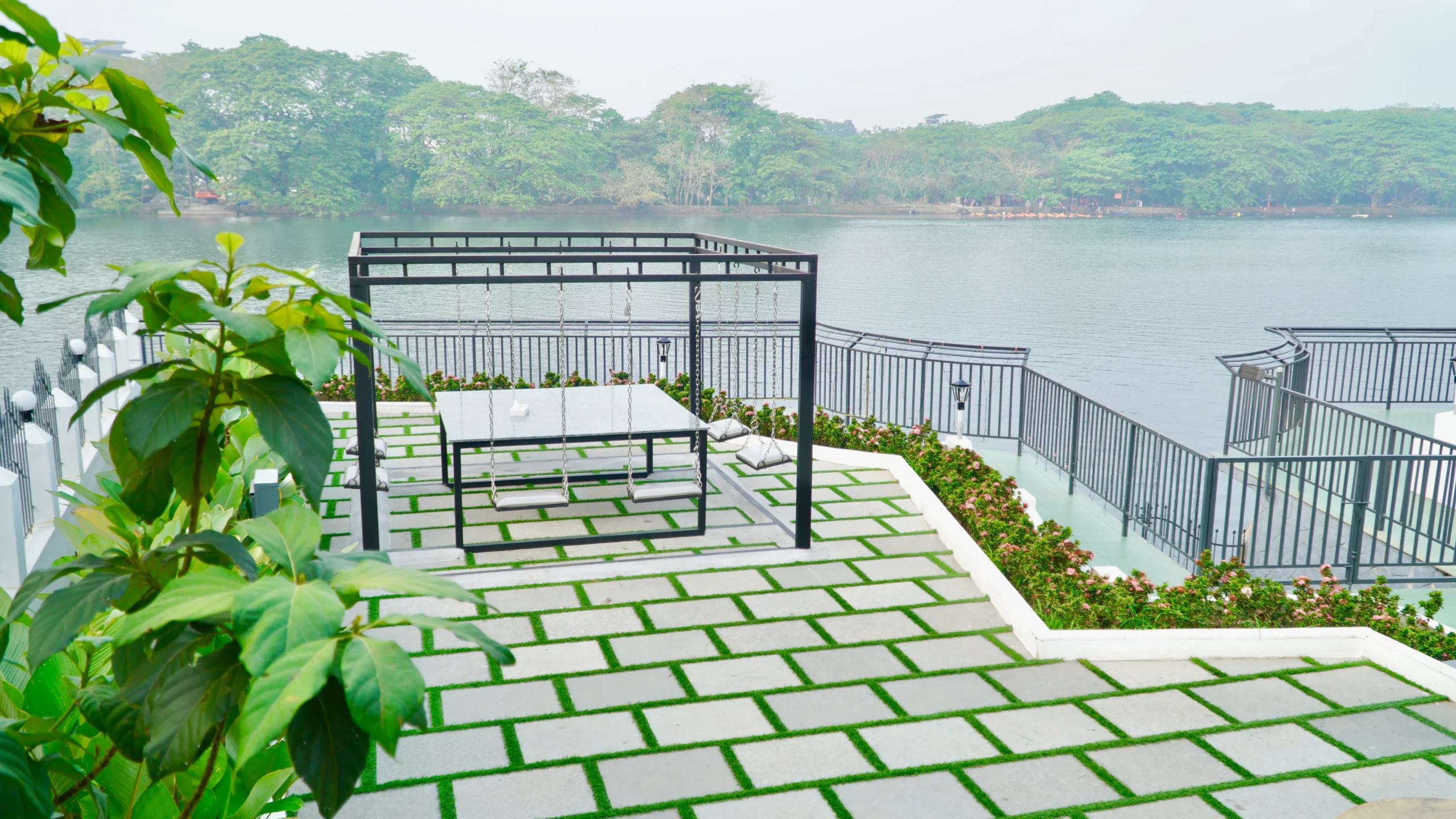 Riverside seating area in with scenic water view and peaceful surroundings in private pool villa kochi