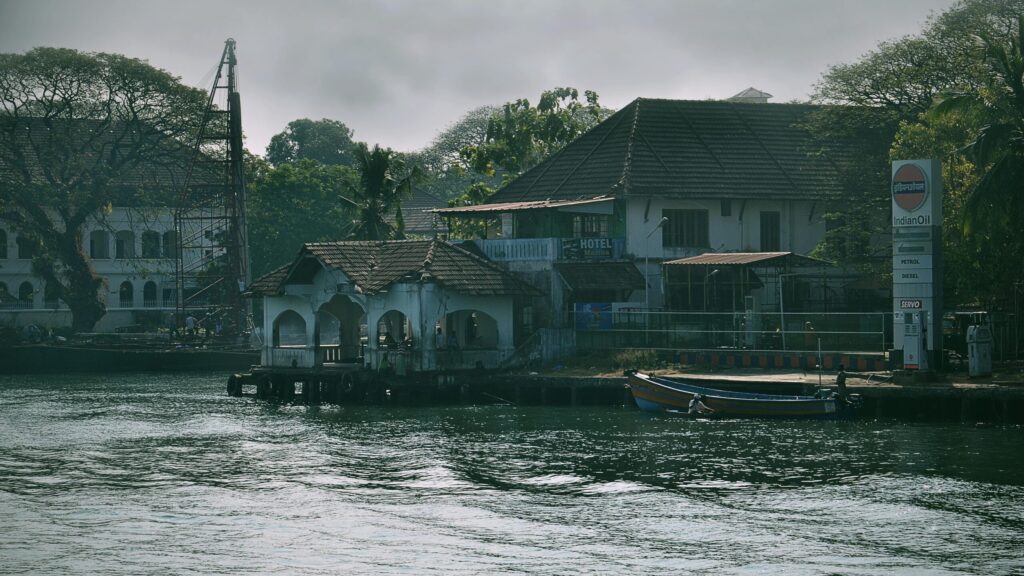 Charming waterfront scene in Kochi, India showcasing traditional architecture and tranquil waters.
